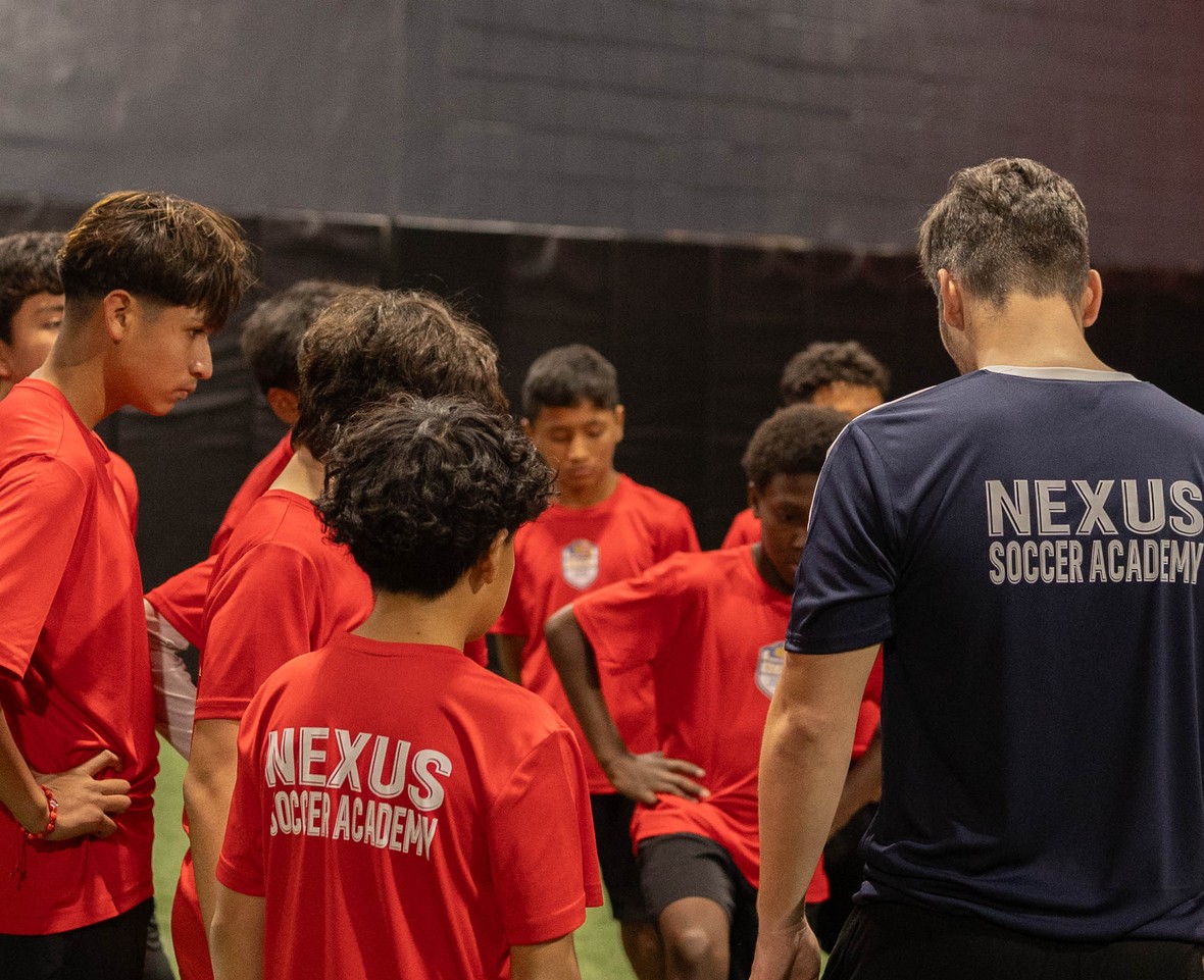Coach Cufi coaching a group clinic session